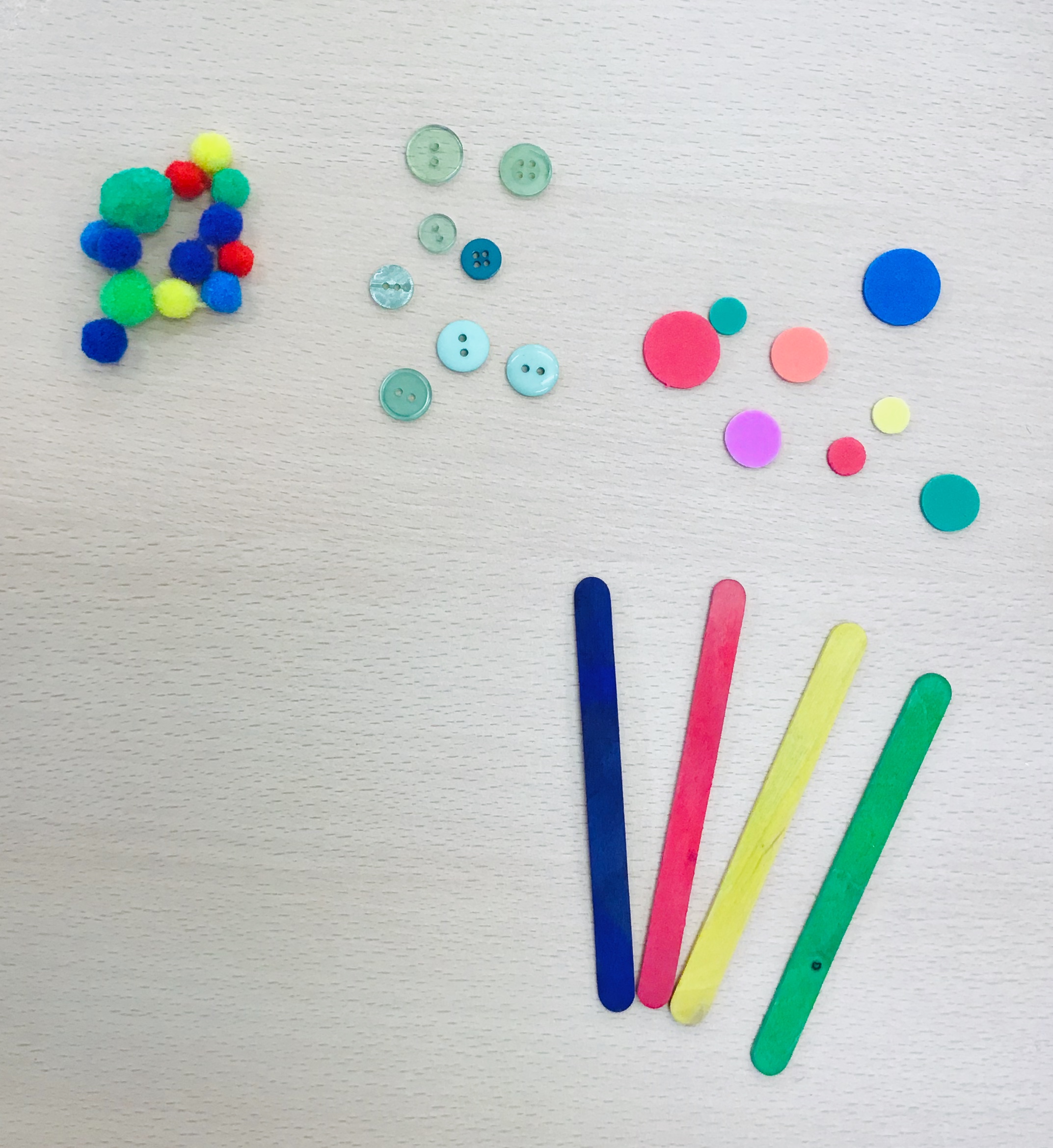 Pom poms sticks and buttons for bookmark decoration