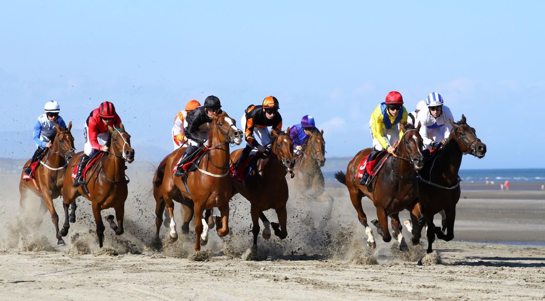 Horse racing on the beach