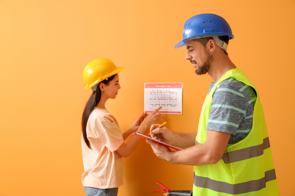 Woman and man doing a fire safety inspection check