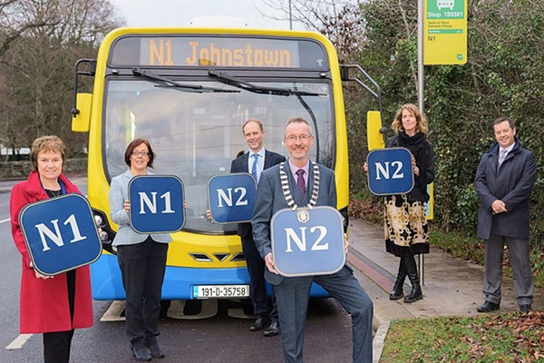 People Standing in Front of Bus