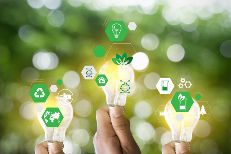 three light bulbs being held aloft by hands with many small energy related icons in green and white surrounding the finger tips