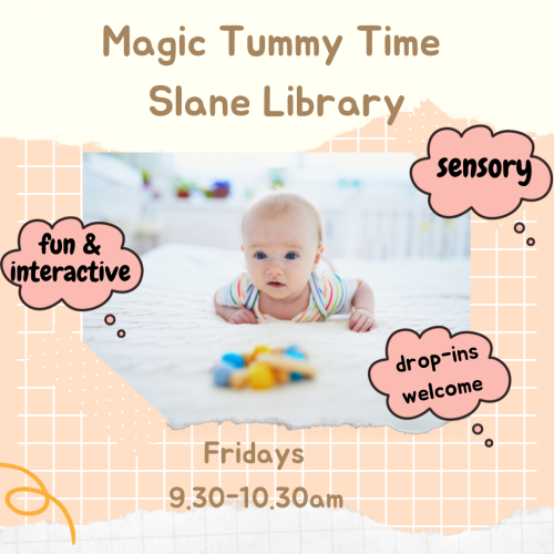 Slane Library Magic Tummy Time Image of infant on its tummy on a white rug looking at a colourful toy