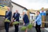 Sod turning with grass on spades