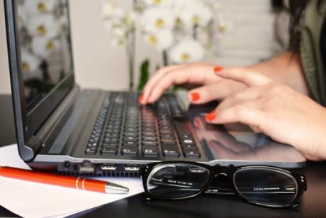 Woman typing on laptop